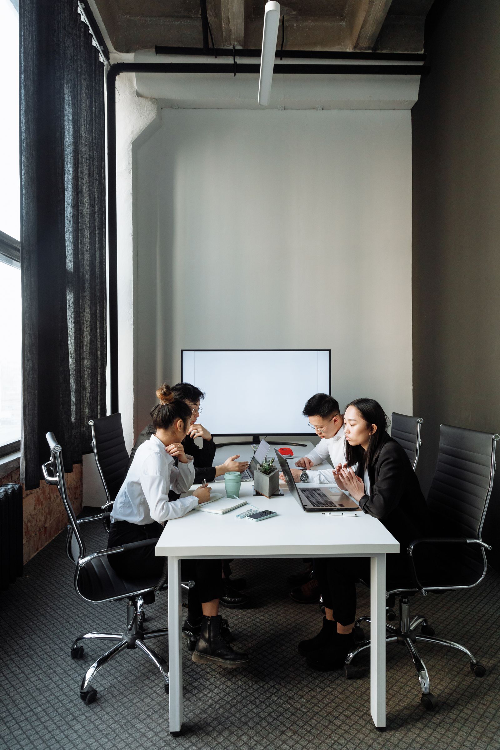 Professionals collaborating around a meeting table